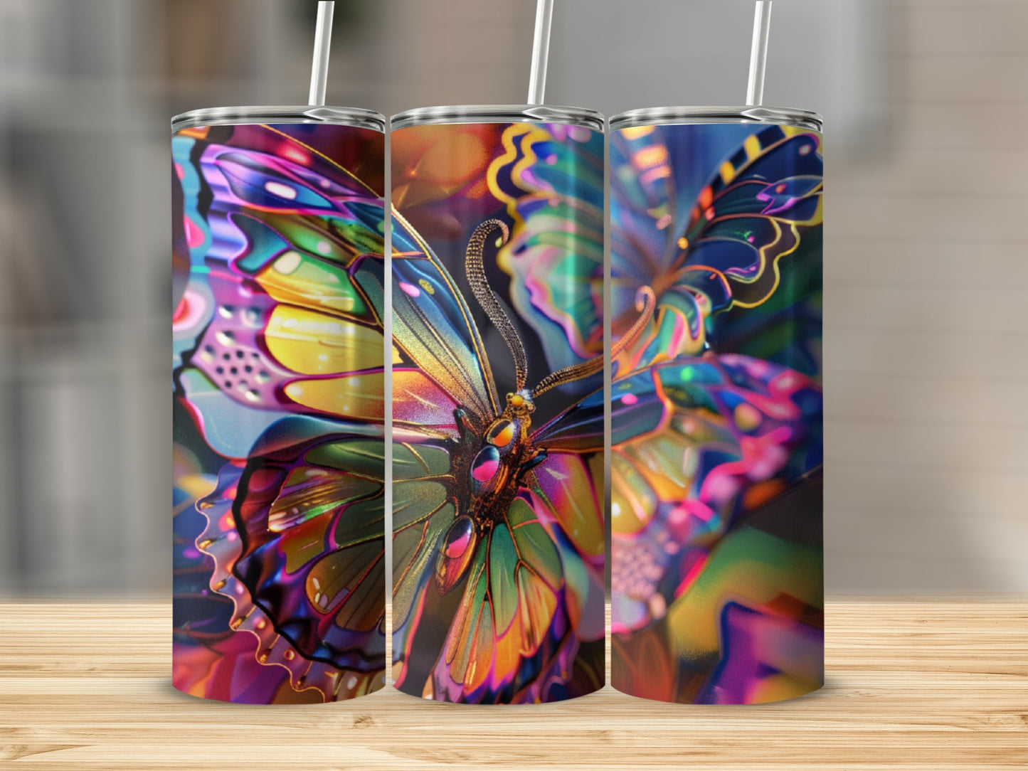 Triptych of tumblers featuring a vibrant, iridescent butterfly design.
