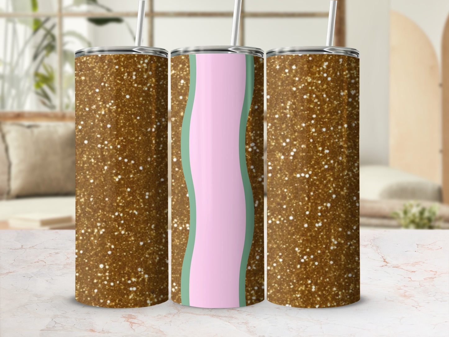 Glittery gold tumblers with pastel green and pink wavy stripes.