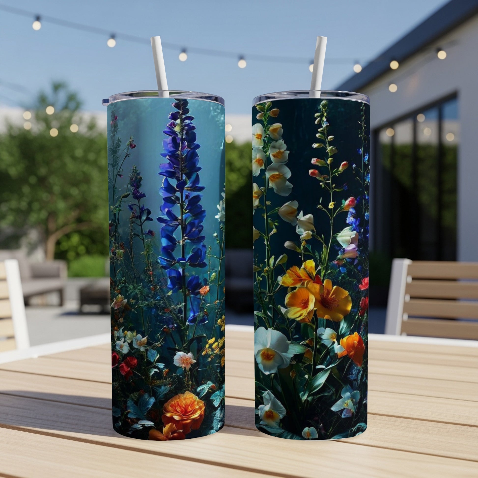 Two tall tumblers with floral designs of wildflowers and delphiniums.