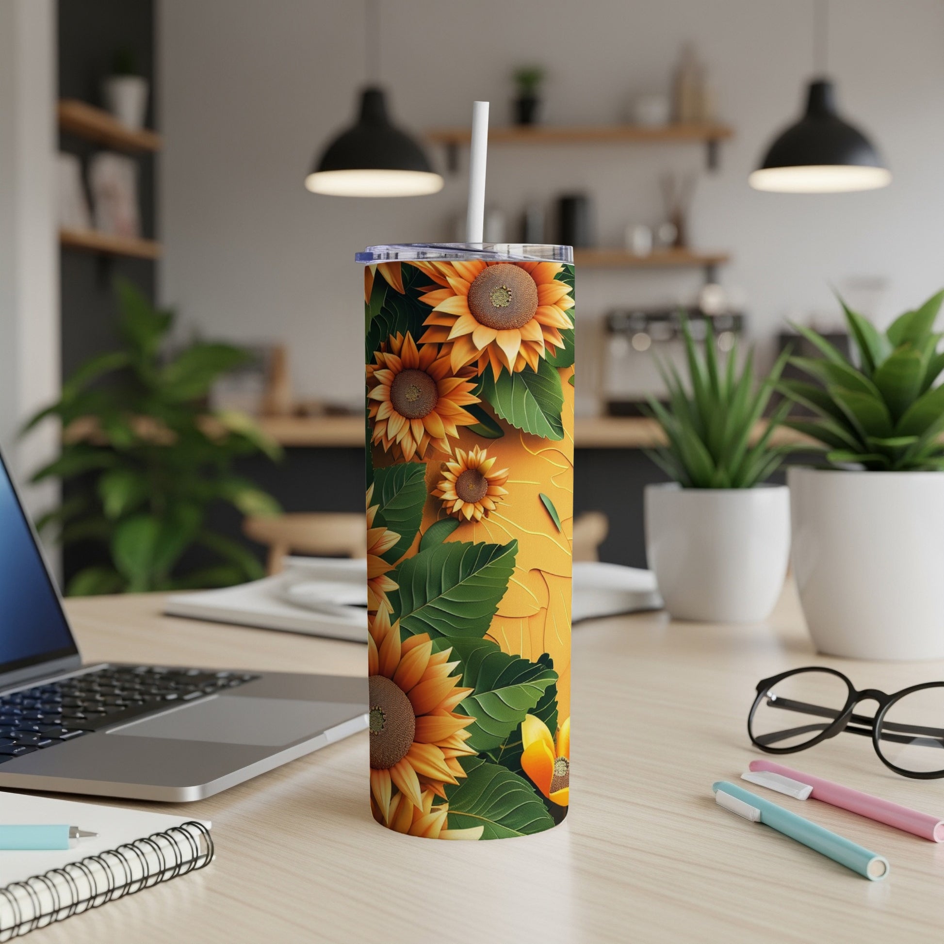Tall tumbler with sunflowers and leaves on a yellow background.