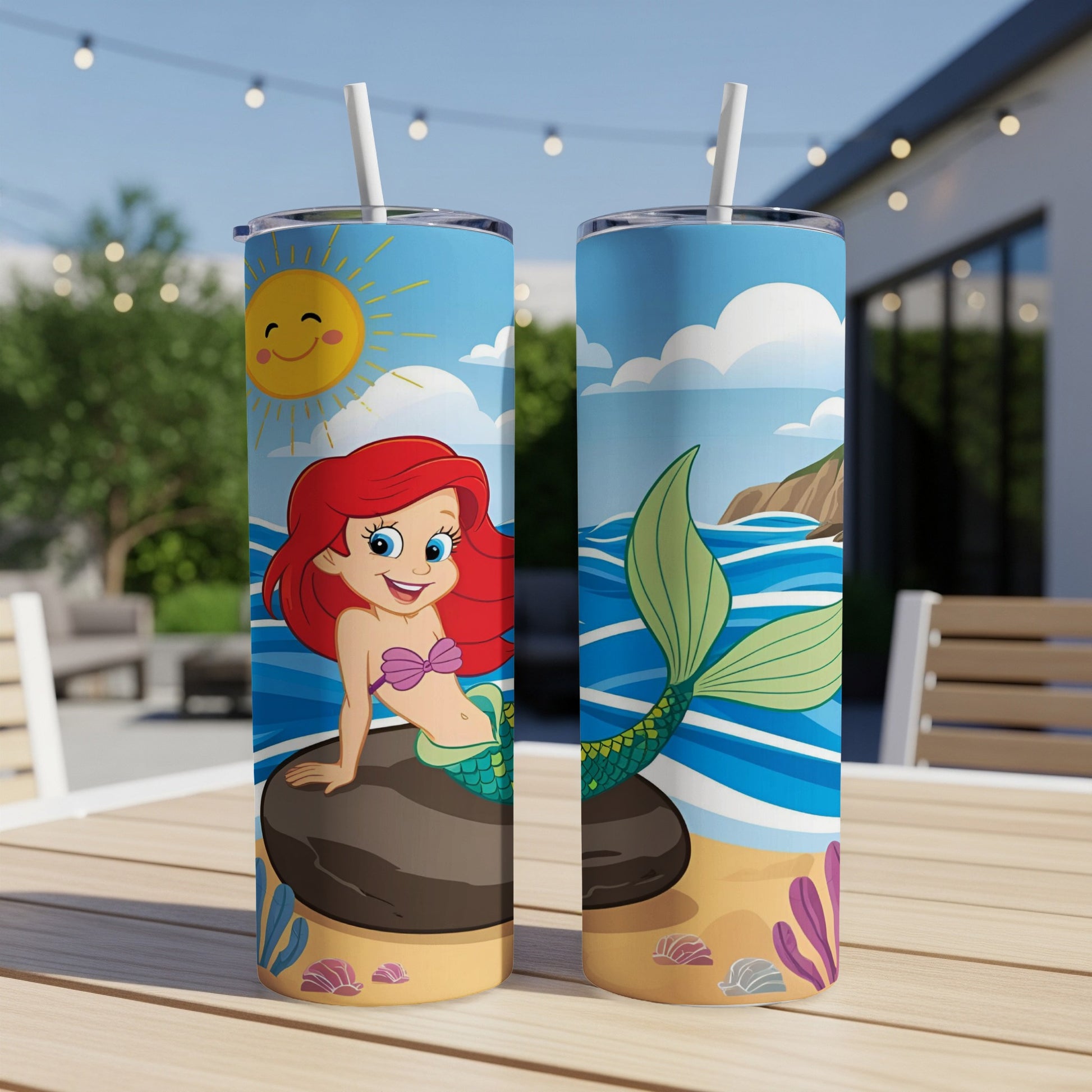 Mermaid with pink hair on rock, and mermaid tail design on a skinny tumbler.