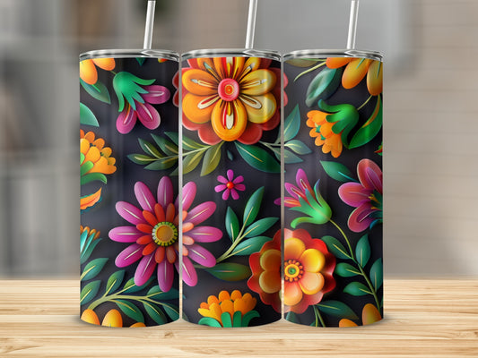 Three tumblers with vibrant floral designs on a wooden surface.