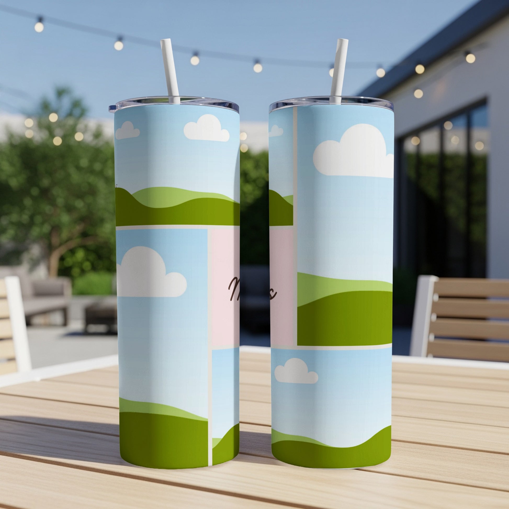 Two tumblers with a sky, cloud, and green hill design.