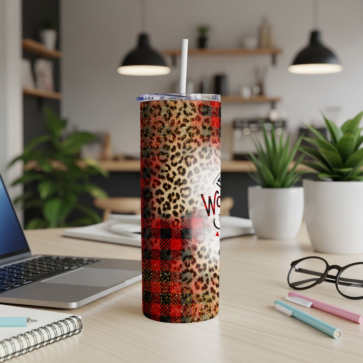 Red plaid and leopard print tumbler with "Wife Life" text on a desk.