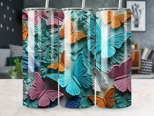 Three colorful butterfly tumblers with textured wings.