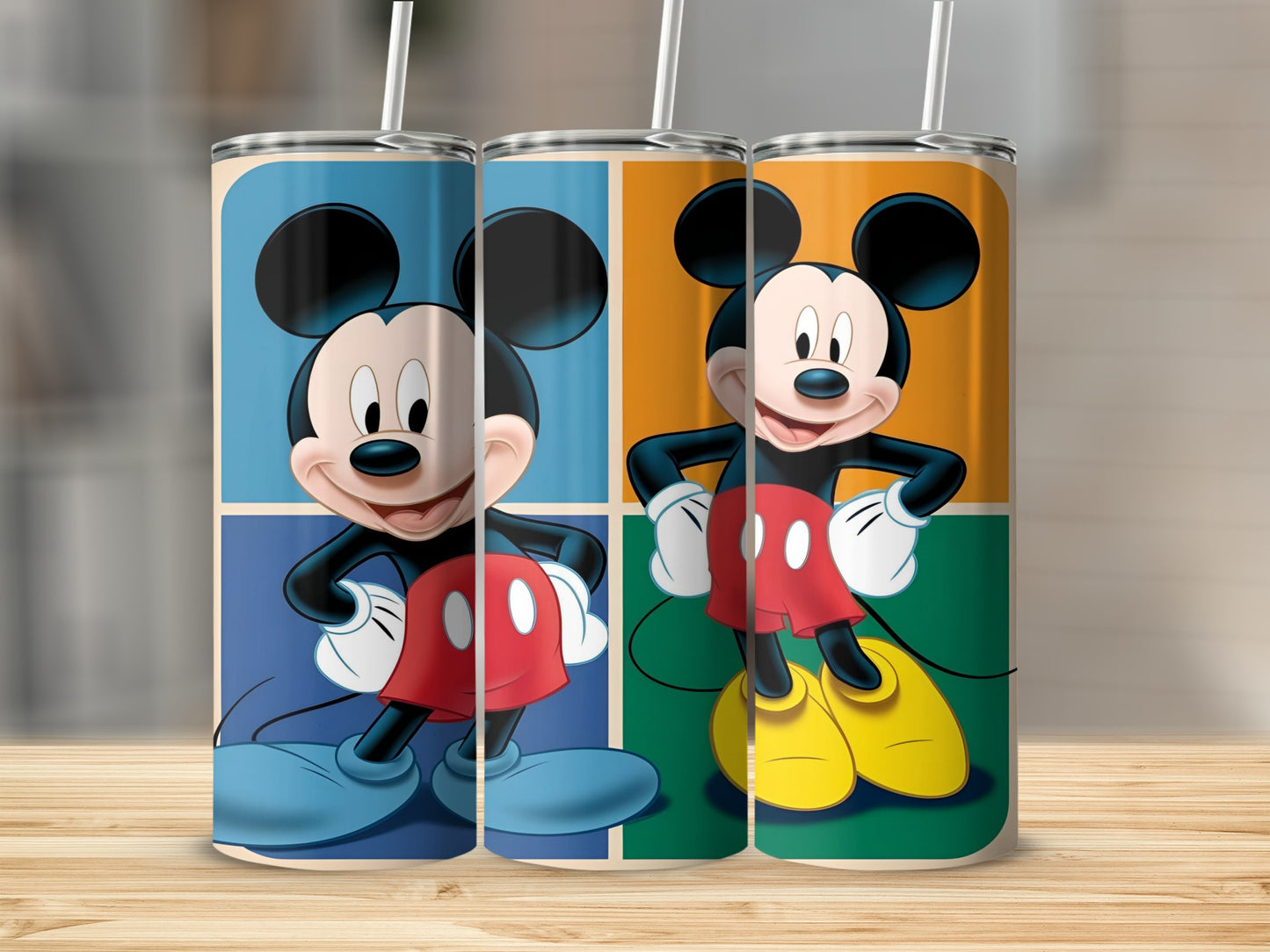 Mickey Mouse in three colorful square panels on a tumbler.