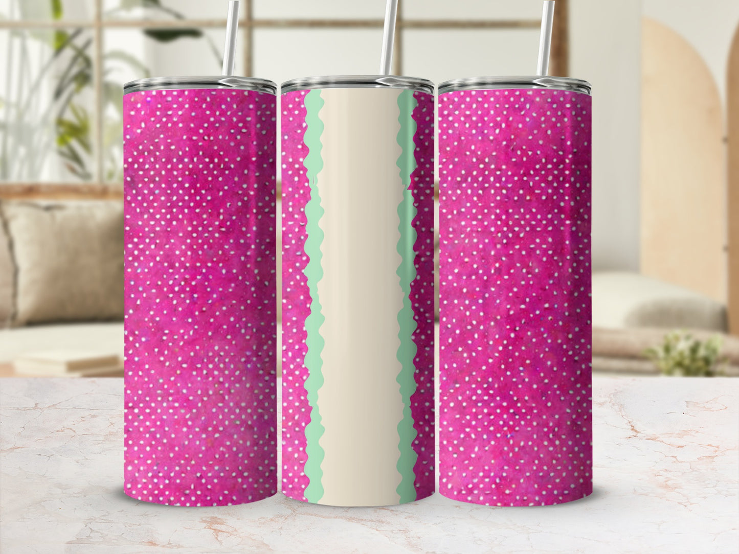 Pink tumbler with white dots and a scalloped green and white band.