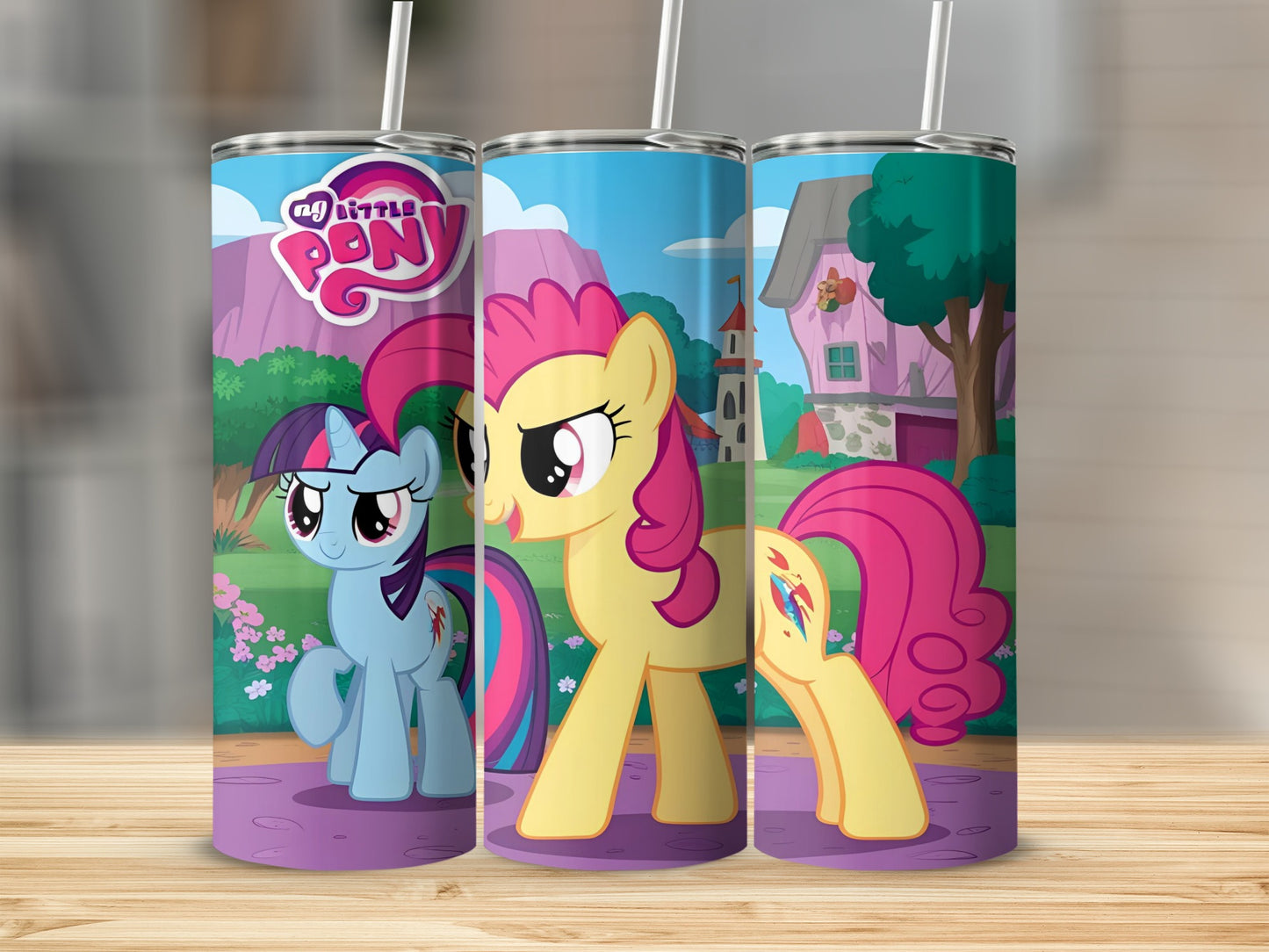 My Little Pony characters on a tumbler with a pink house and purple hills.