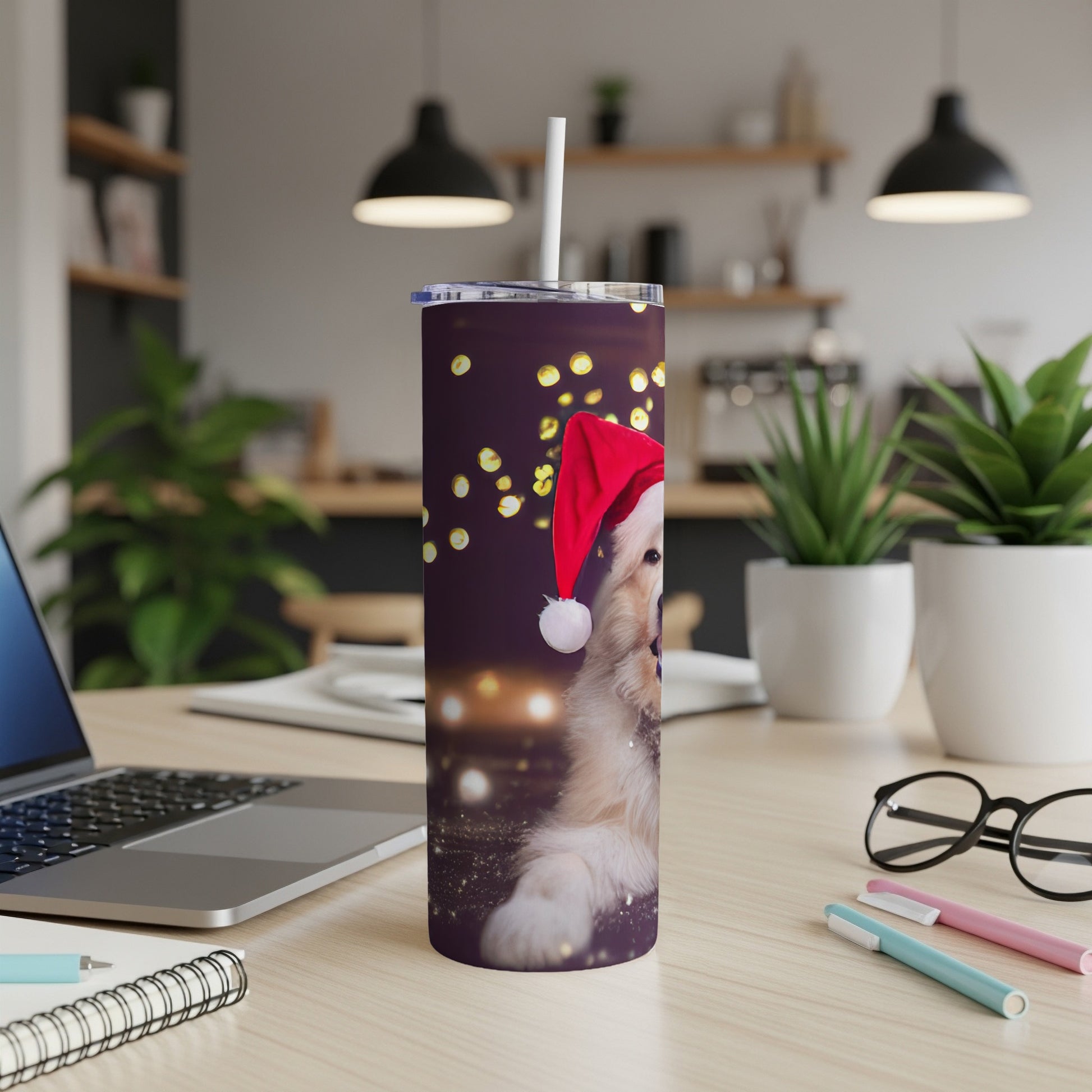 Golden retriever puppy in Santa hat on a purple tumbler with bokeh lights.