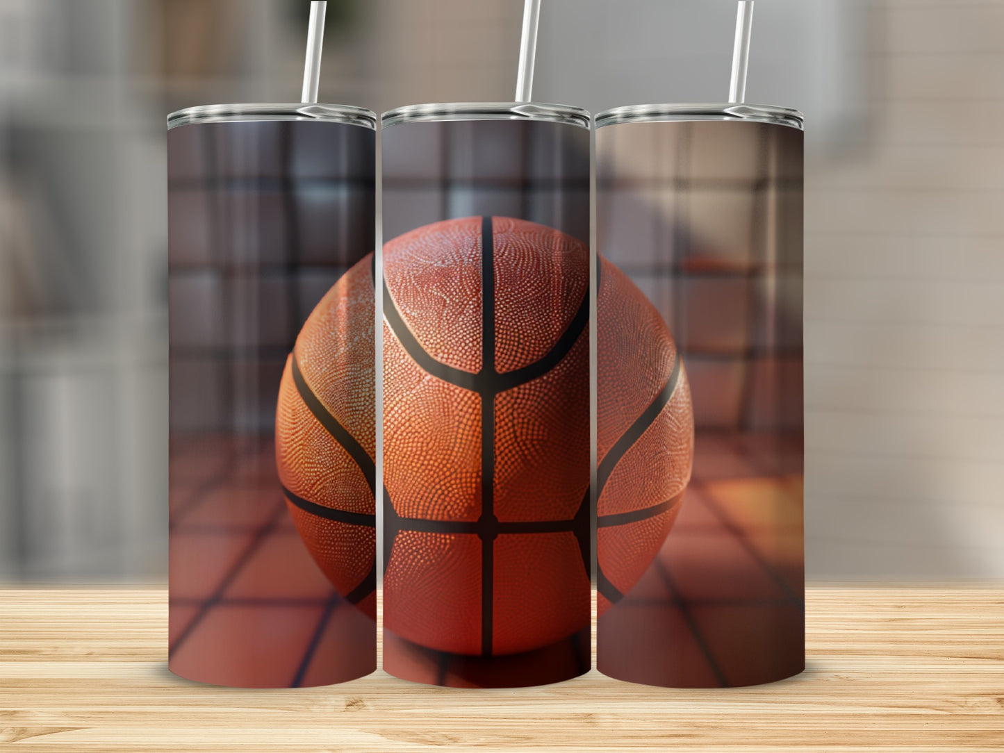 Three tumblers with a basketball graphic on a wooden surface.