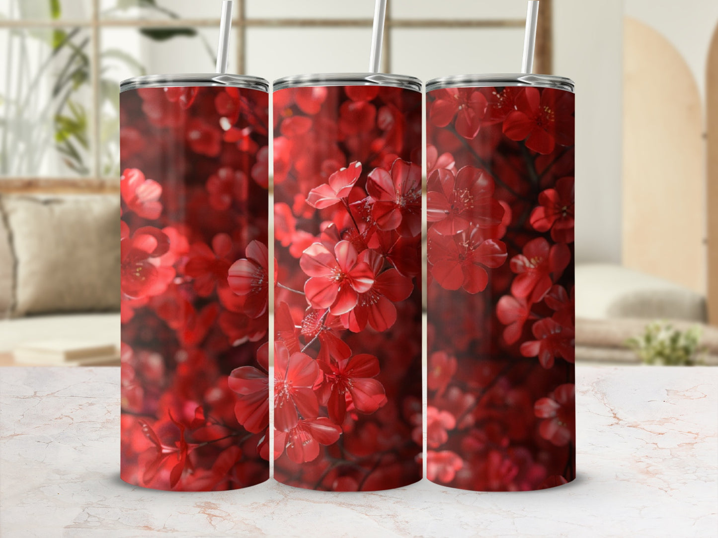 Three tumblers with a close-up floral pattern of red blossoms.