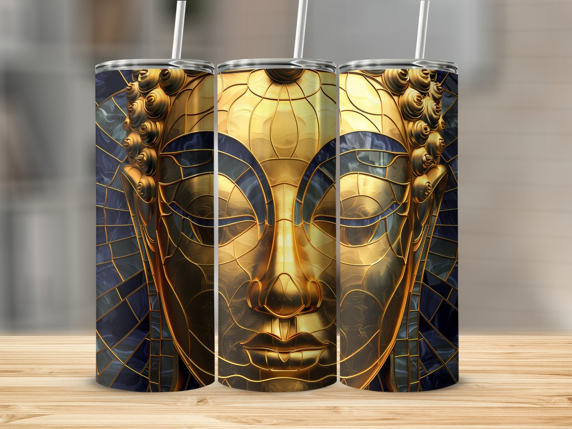 Three golden Buddha tumblers with intricate geometric patterns.