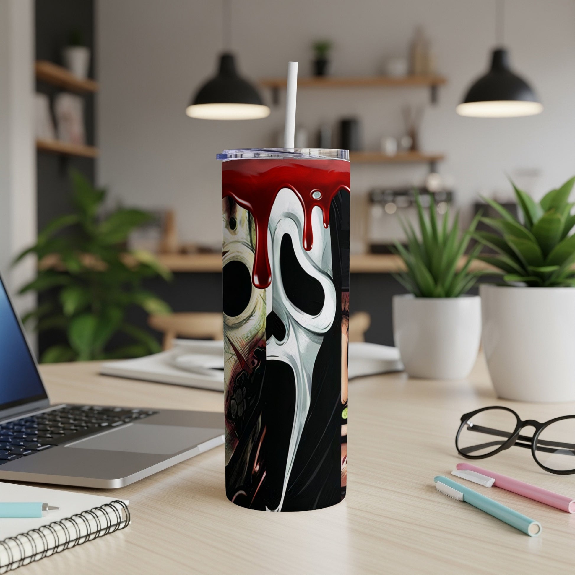 Tumbler with horror movie mask designs and dripping red paint.