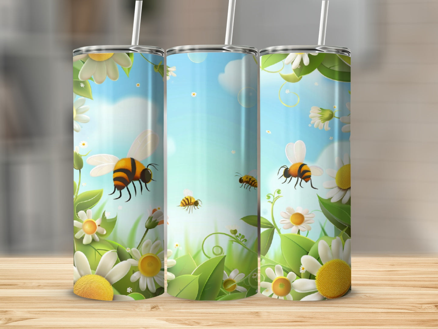 Three tumblers with a bee and daisy floral design.