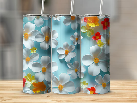Three tumblers with blue background and white, yellow, and red flowers.