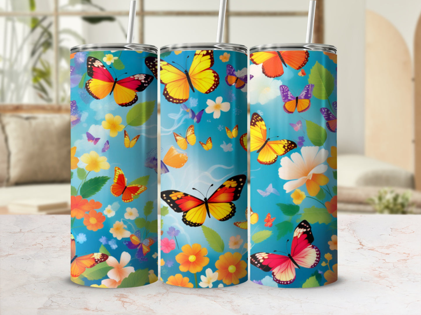 Three tumblers with butterflies and flowers against a bright, colorful background.