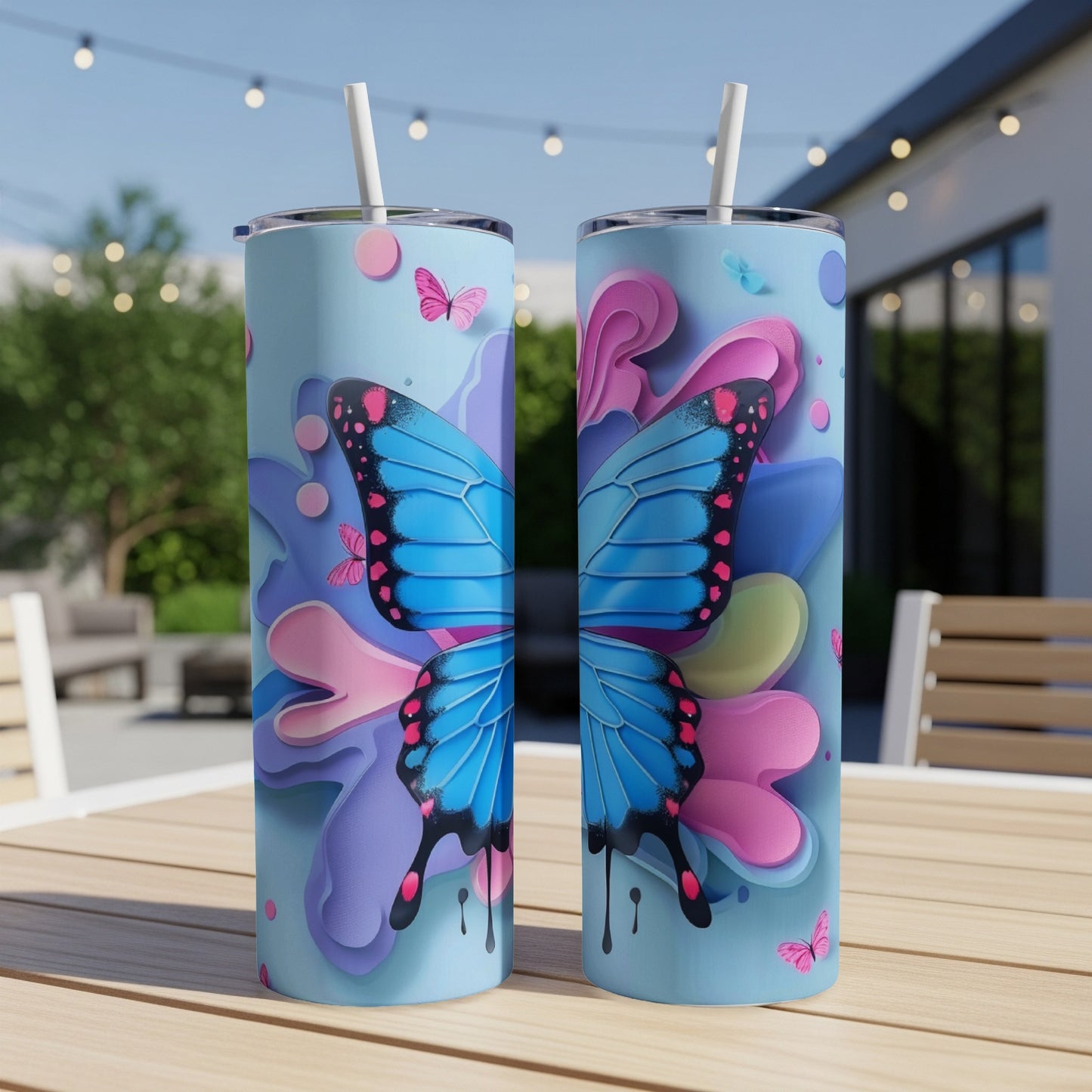 Blue butterfly on a pink and purple floral background on two tumblers.