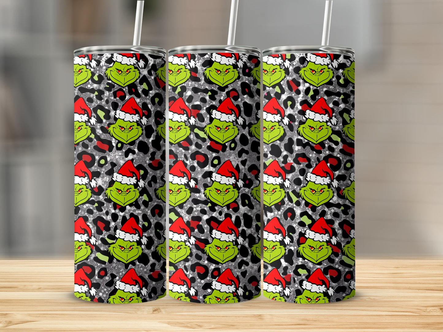 Grinch pattern on glitter tumbler with leopard print background.