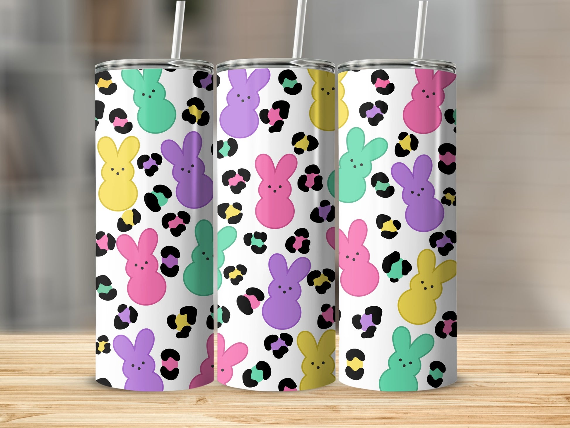 Three tumblers with a colorful bunny and leopard print pattern.