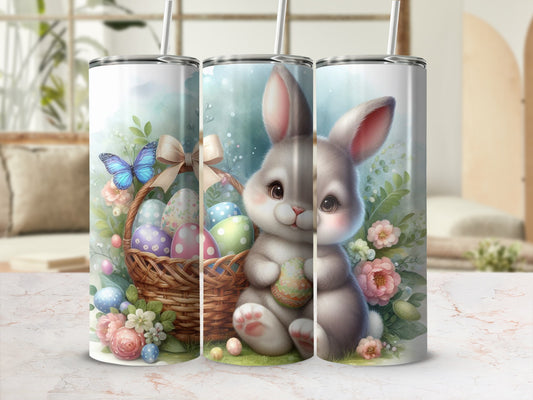 Easter bunny with basket of colorful eggs and flowers, on a marble countertop.
