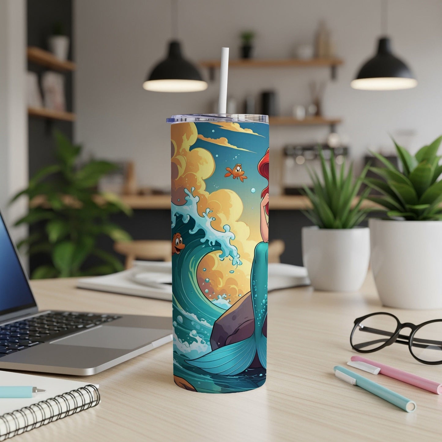 Ariel the Little Mermaid on a skinny tumbler with ocean waves.