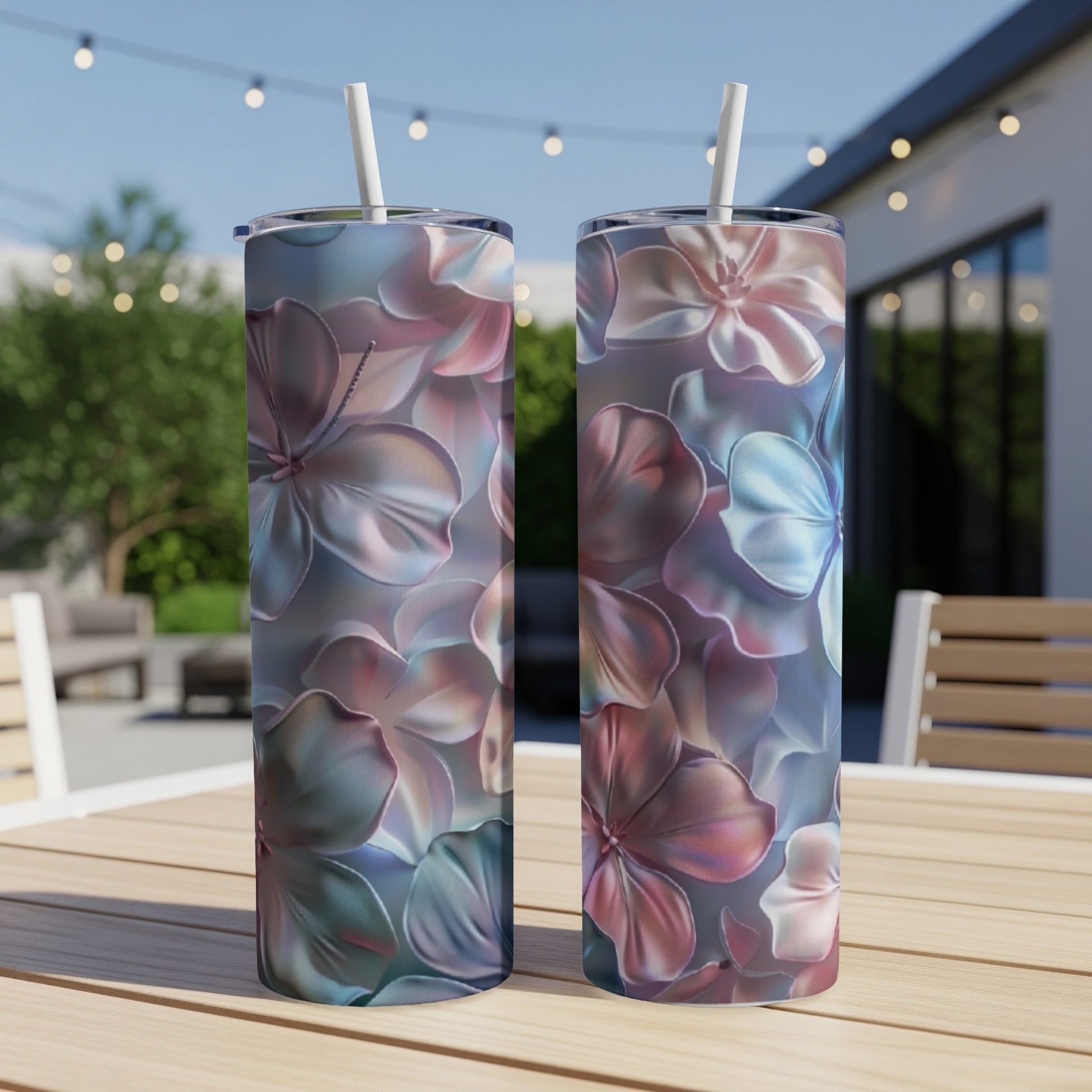 Two tumblers with a floral pattern featuring pink and blue hibiscus flowers.