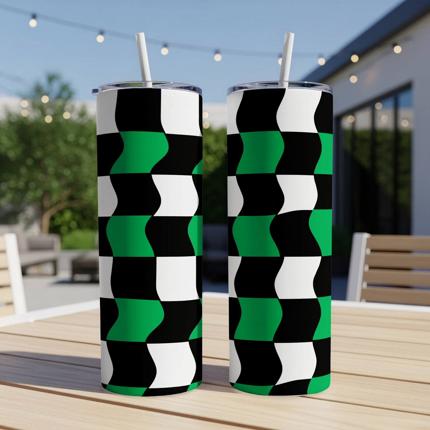 Two tall tumblers with a black, white, and green checkered wavy pattern.