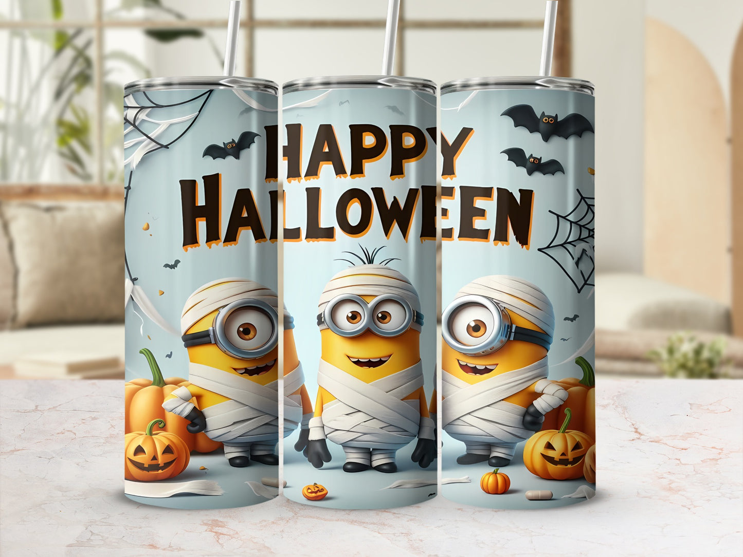 Three mummy Minions with pumpkins and bats on a Halloween themed tumbler.