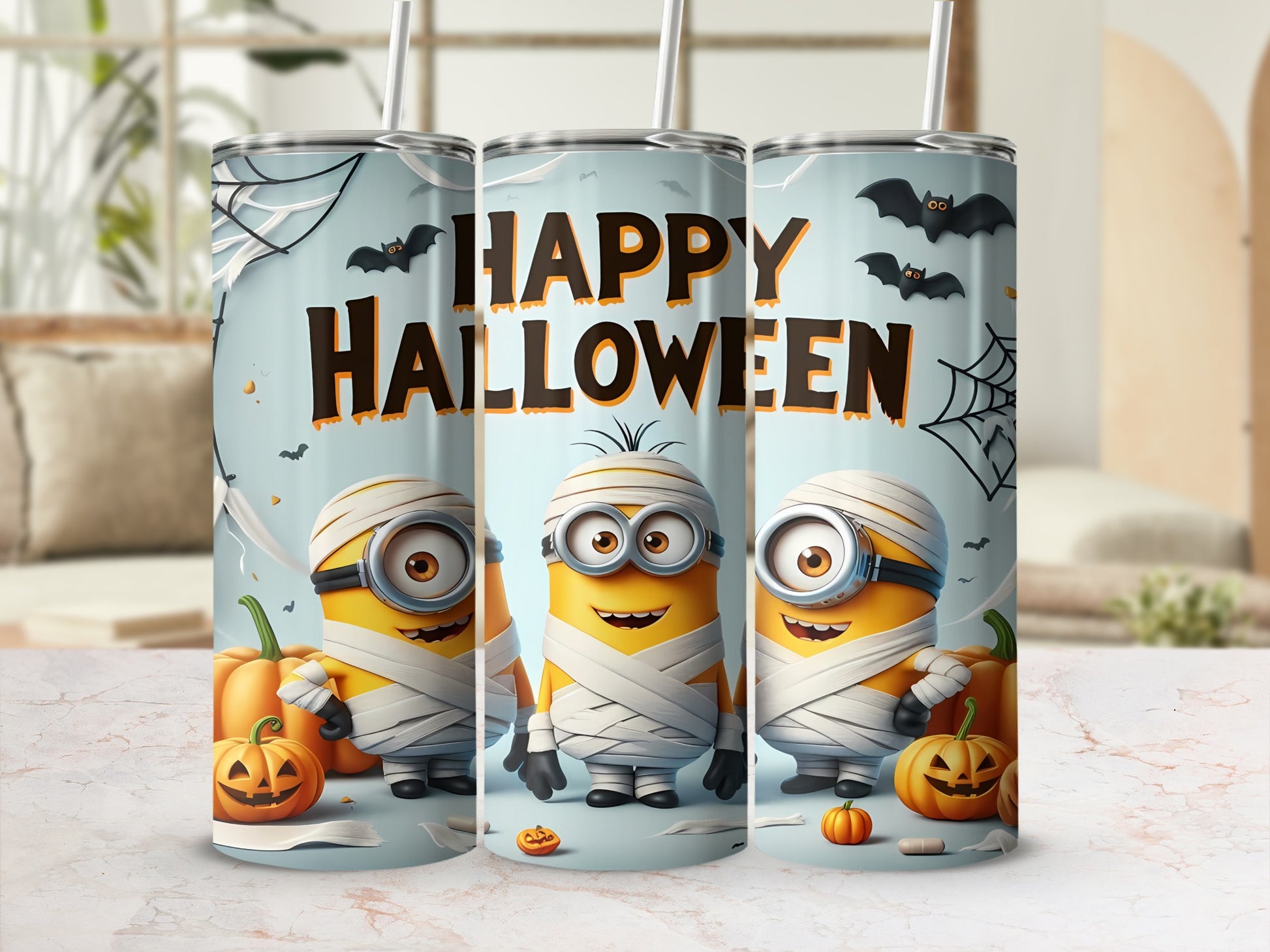 Three mummy Minions with pumpkins and bats on a Halloween themed tumbler.