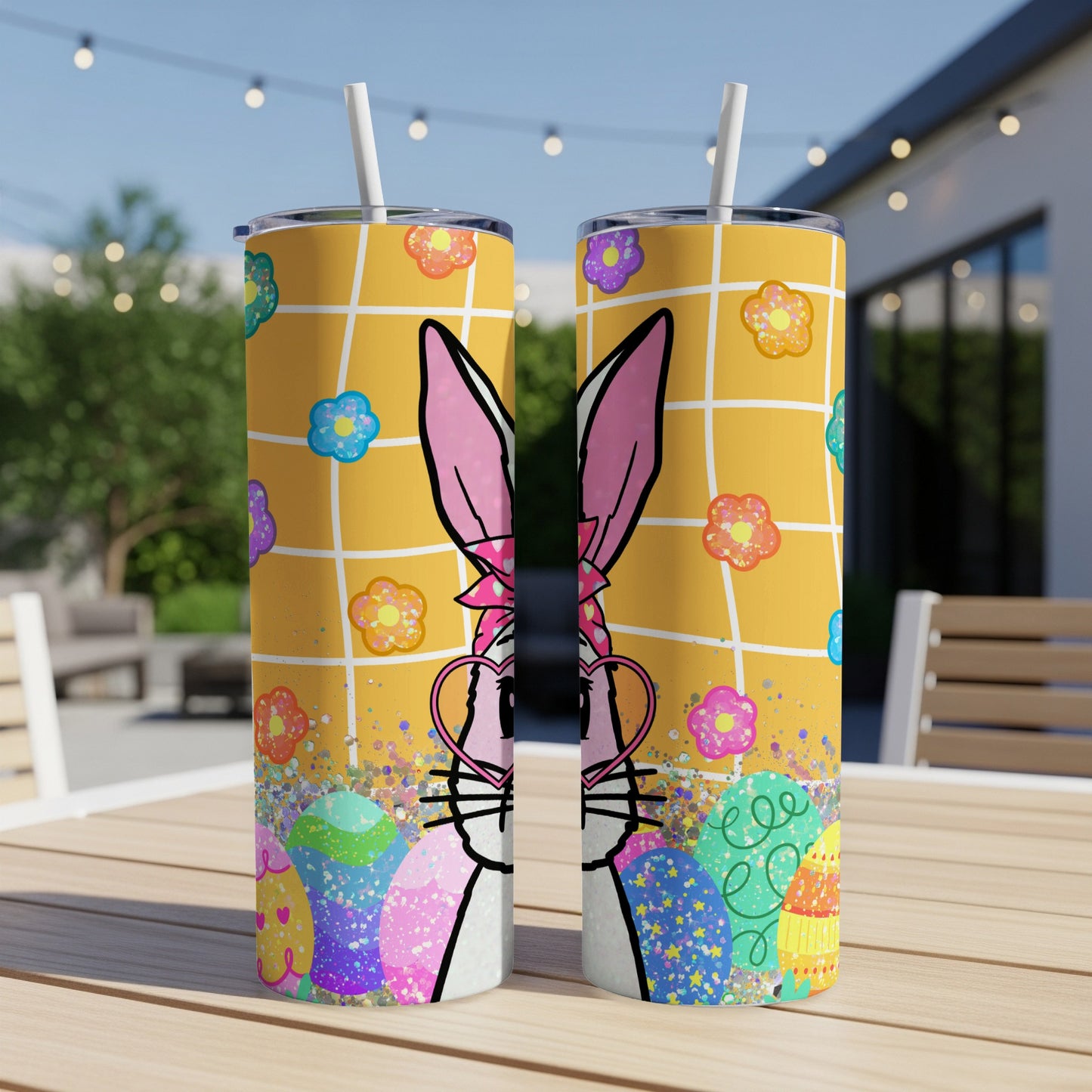 Easter bunny tumbler with colorful eggs and floral pattern.