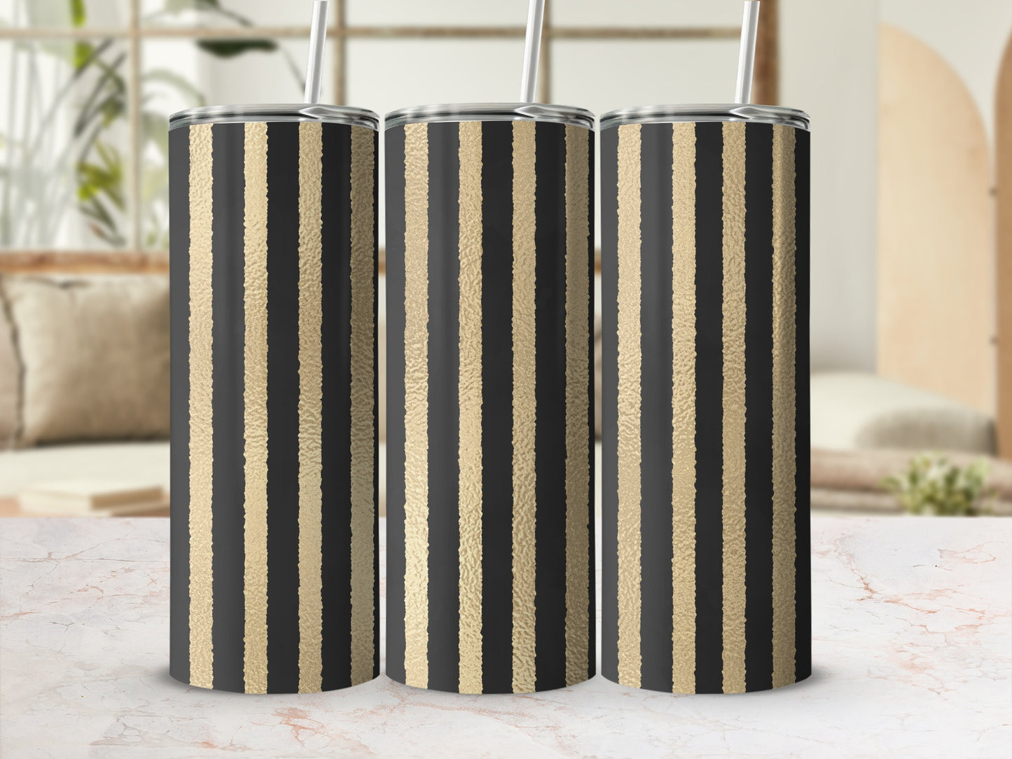 Three tumblers with black and gold vertical stripes.