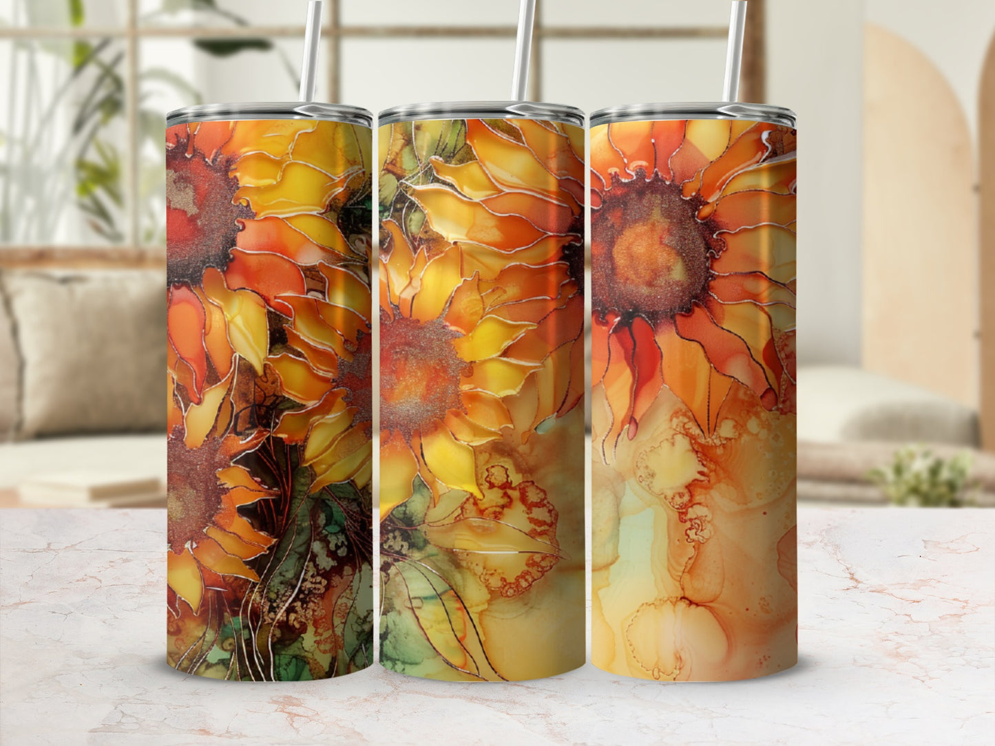 Three tumblers with vibrant orange and yellow sunflower and abstract watercolor patterns.