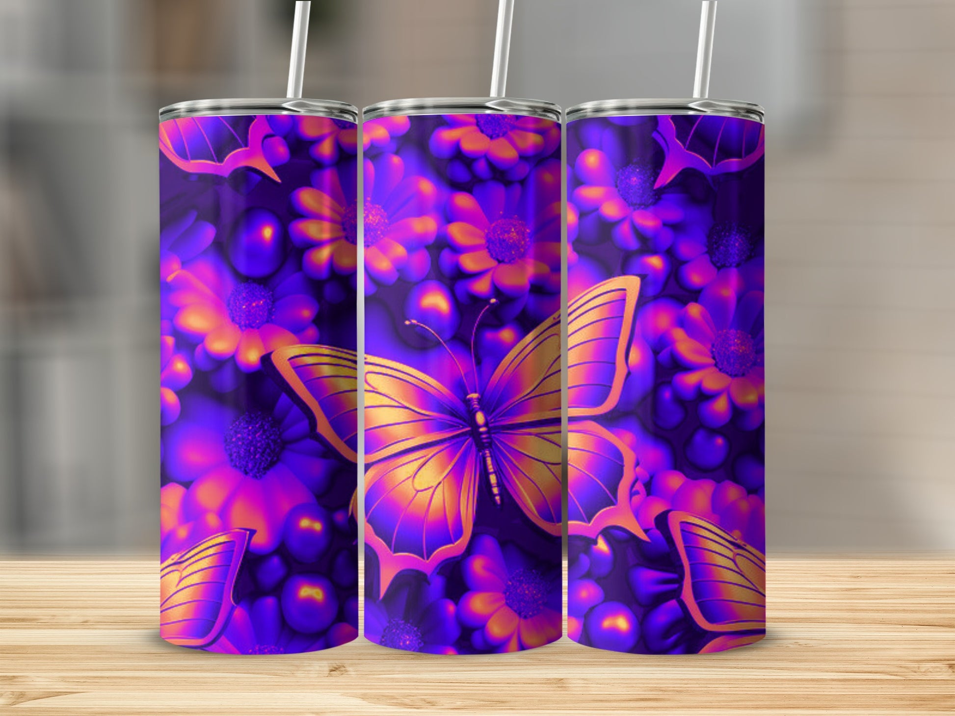 Purple and orange butterfly and flower pattern on three tumblers.
