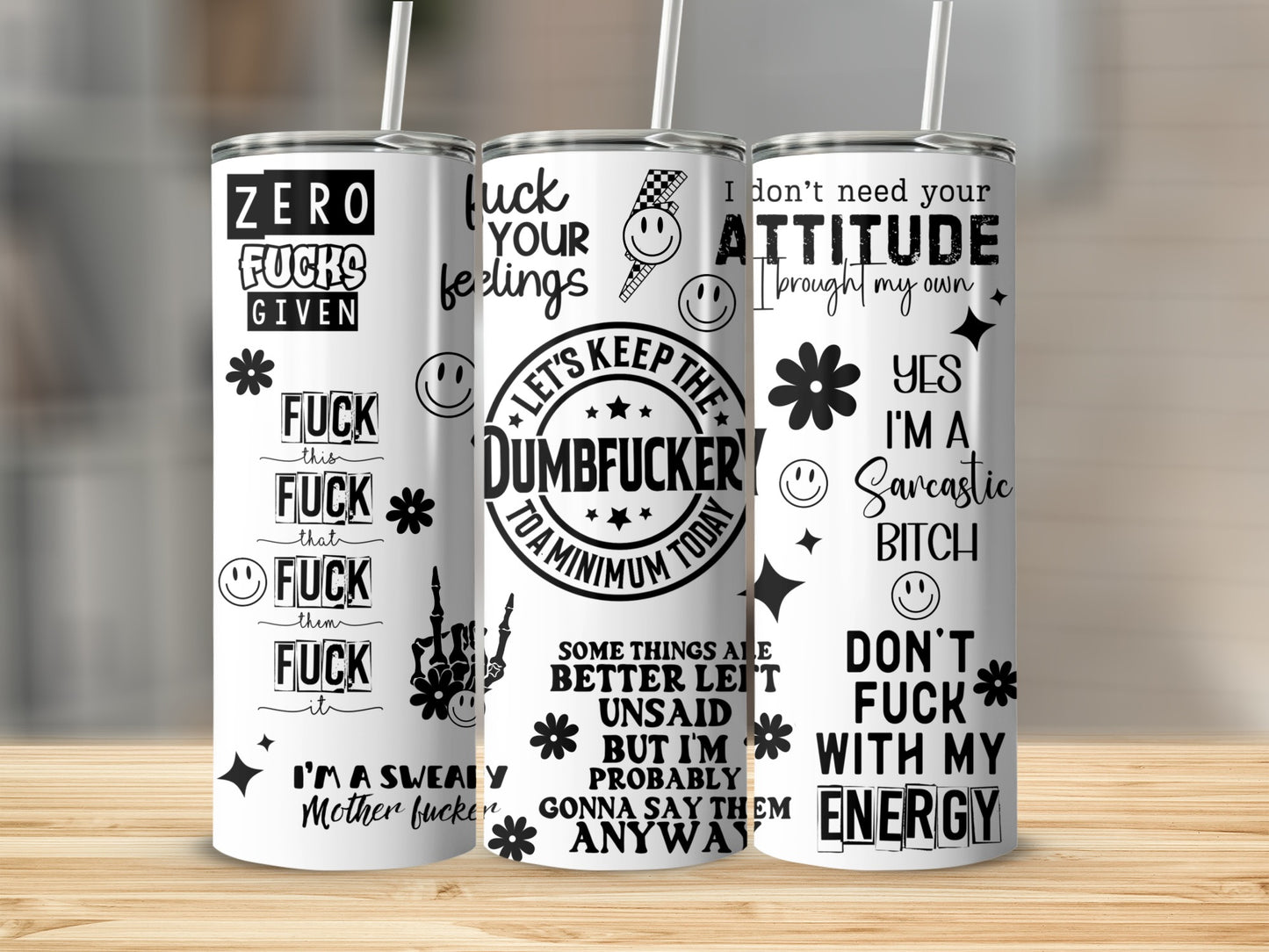 Three tumblers with humorous sayings in white, black, and plaid designs.