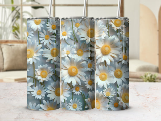 Three tumblers with a white daisy floral pattern and straws.