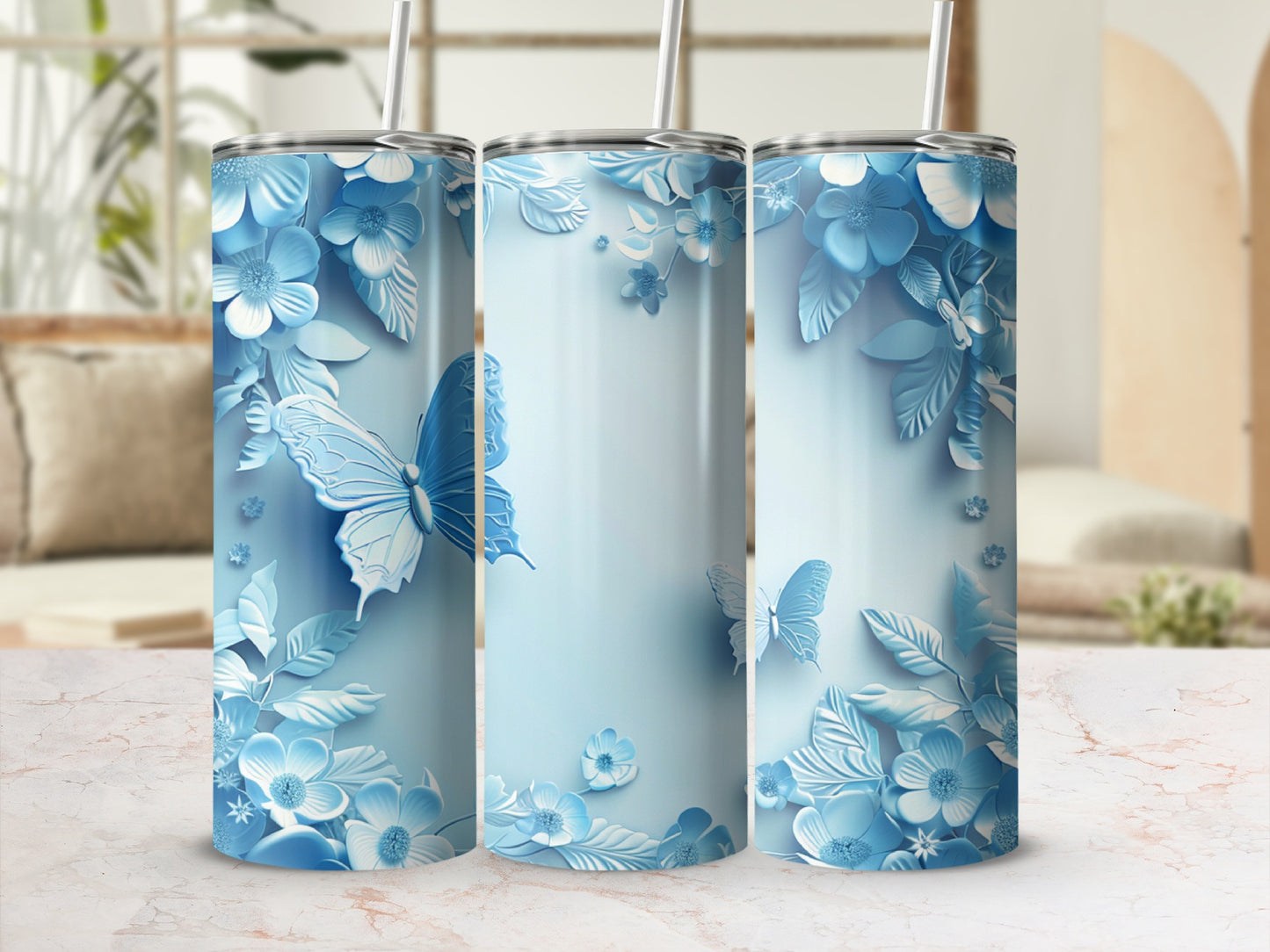 Blue floral and butterfly pattern on three 20oz tumblers.