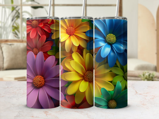 Three tumblers with colorful flower designs, red, yellow, and blue.