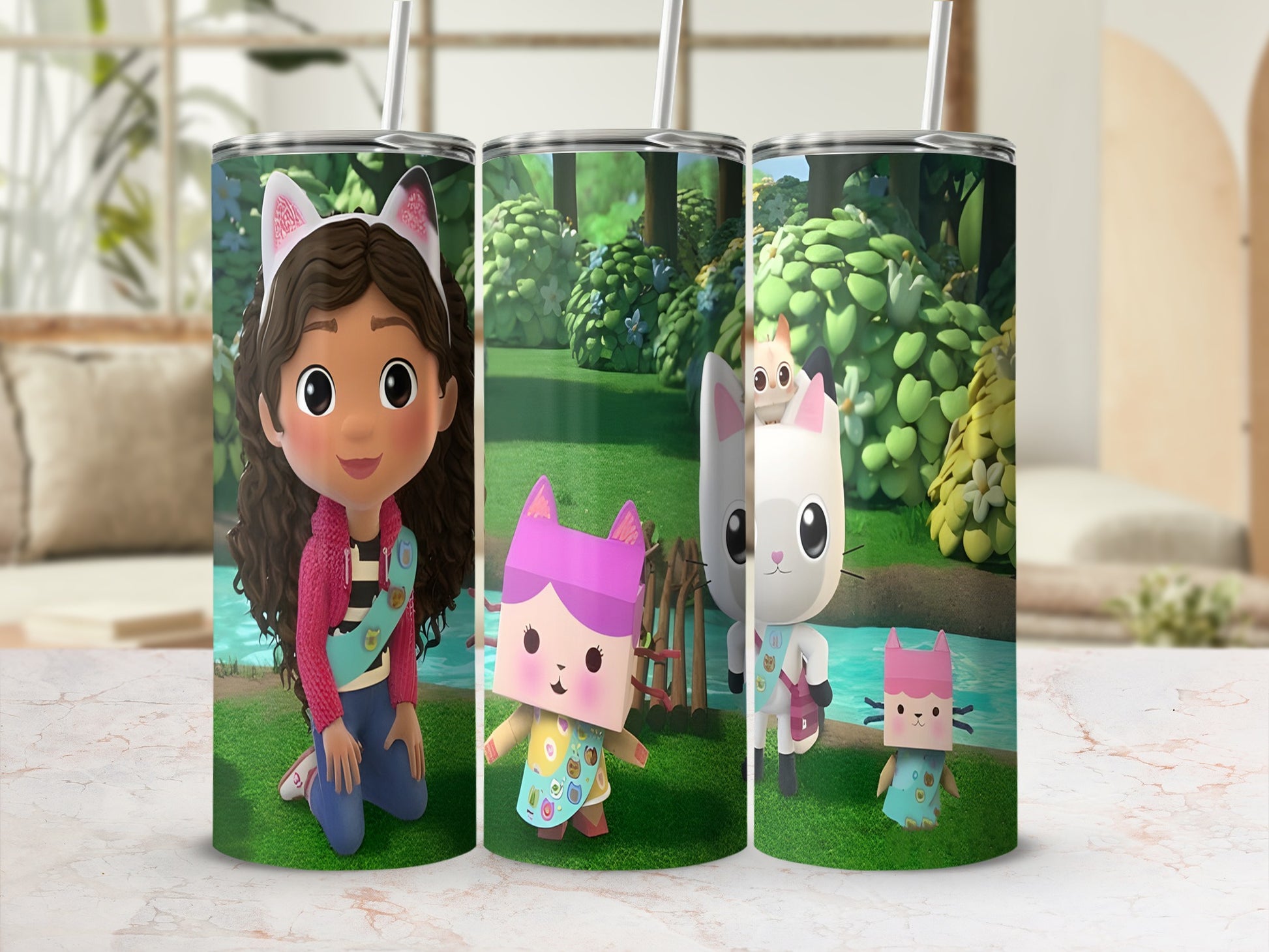 Gabby's Dollhouse characters Gabby, Pandy Paws, and Cakey Cat on a patterned tumbler.
