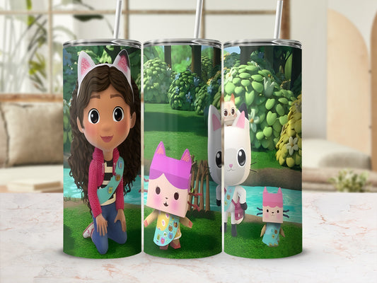 Gabby's Dollhouse characters Gabby, Pandy Paws, and Cakey Cat on a patterned tumbler.