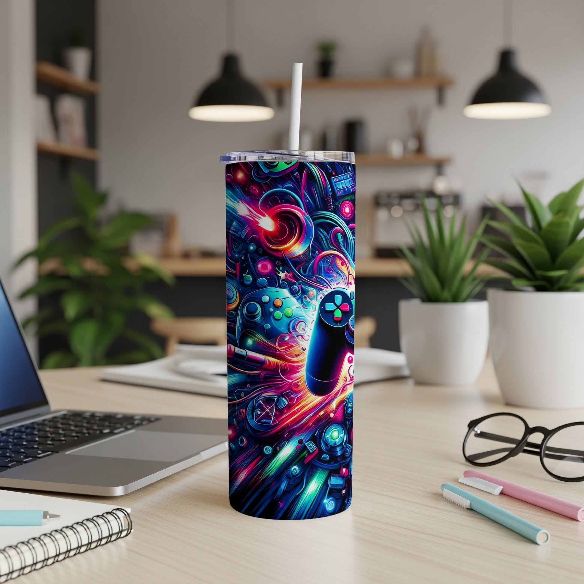 Tumbler with colorful, abstract video game controllers and abstract shapes.