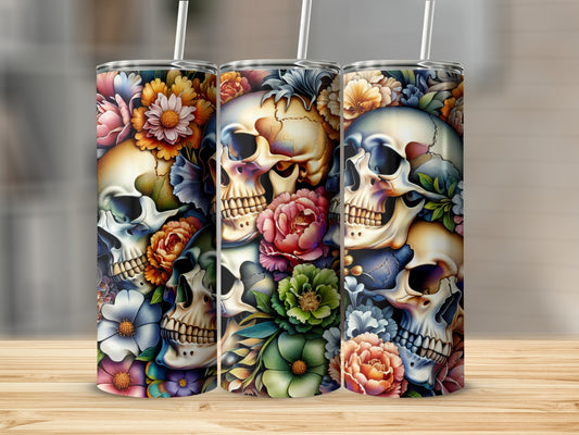 Three tumblers with floral and skull designs.