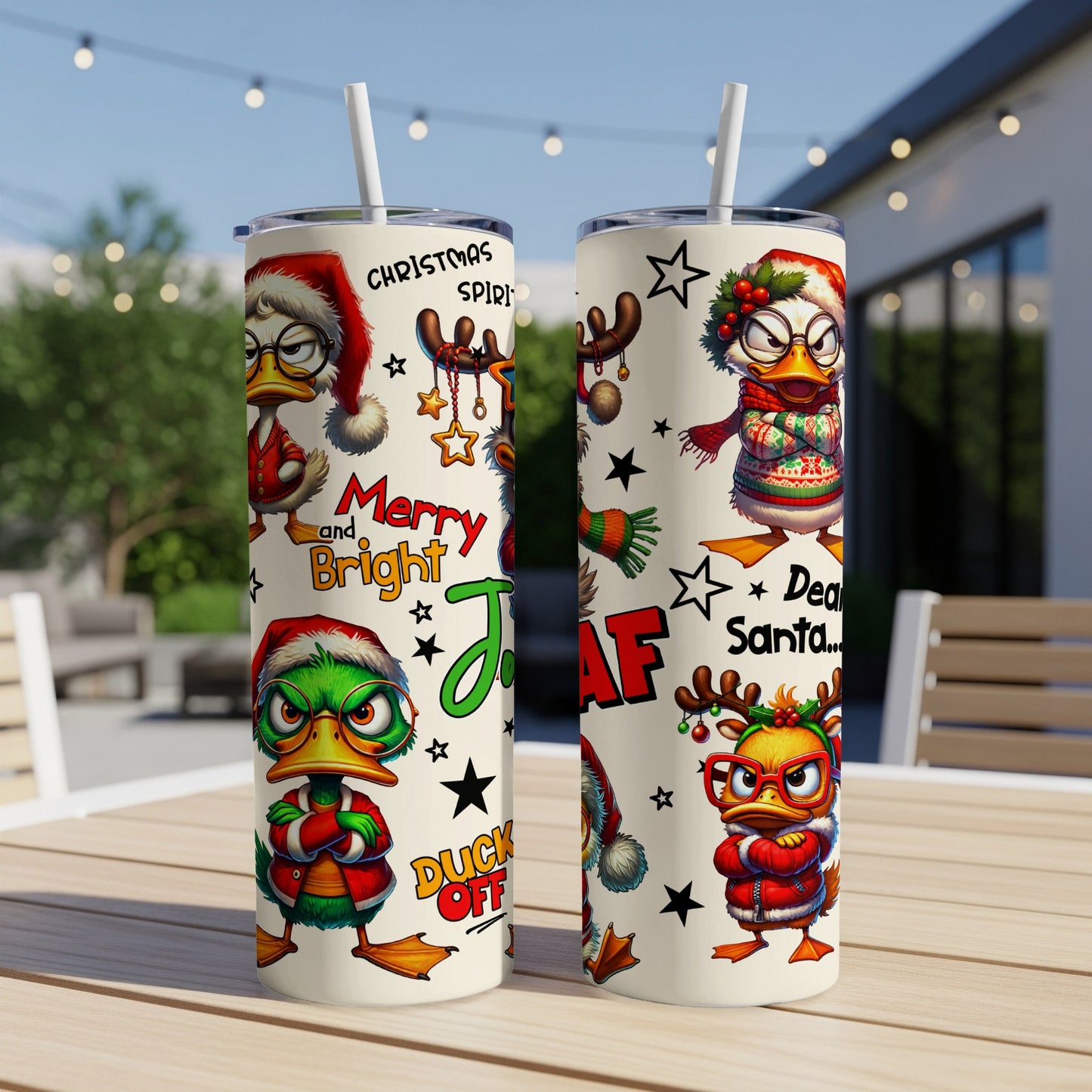 Two tumblers with cartoon ducks wearing Christmas hats and sweaters.
