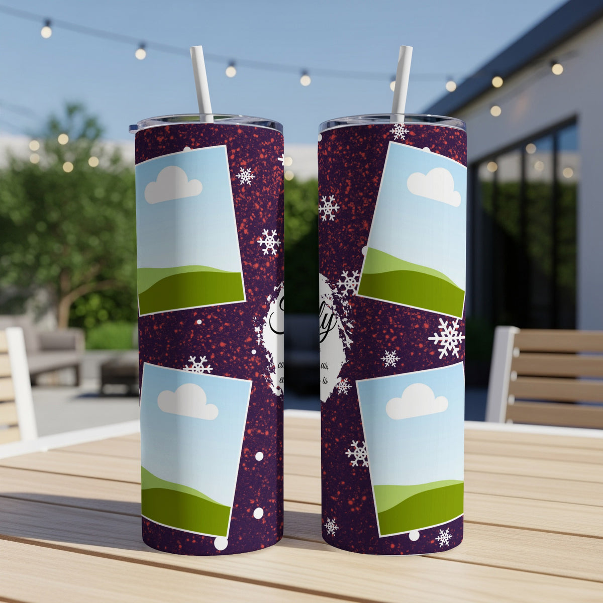 Purple tumbler with photo frames of clouds and hills, and snowflakes.