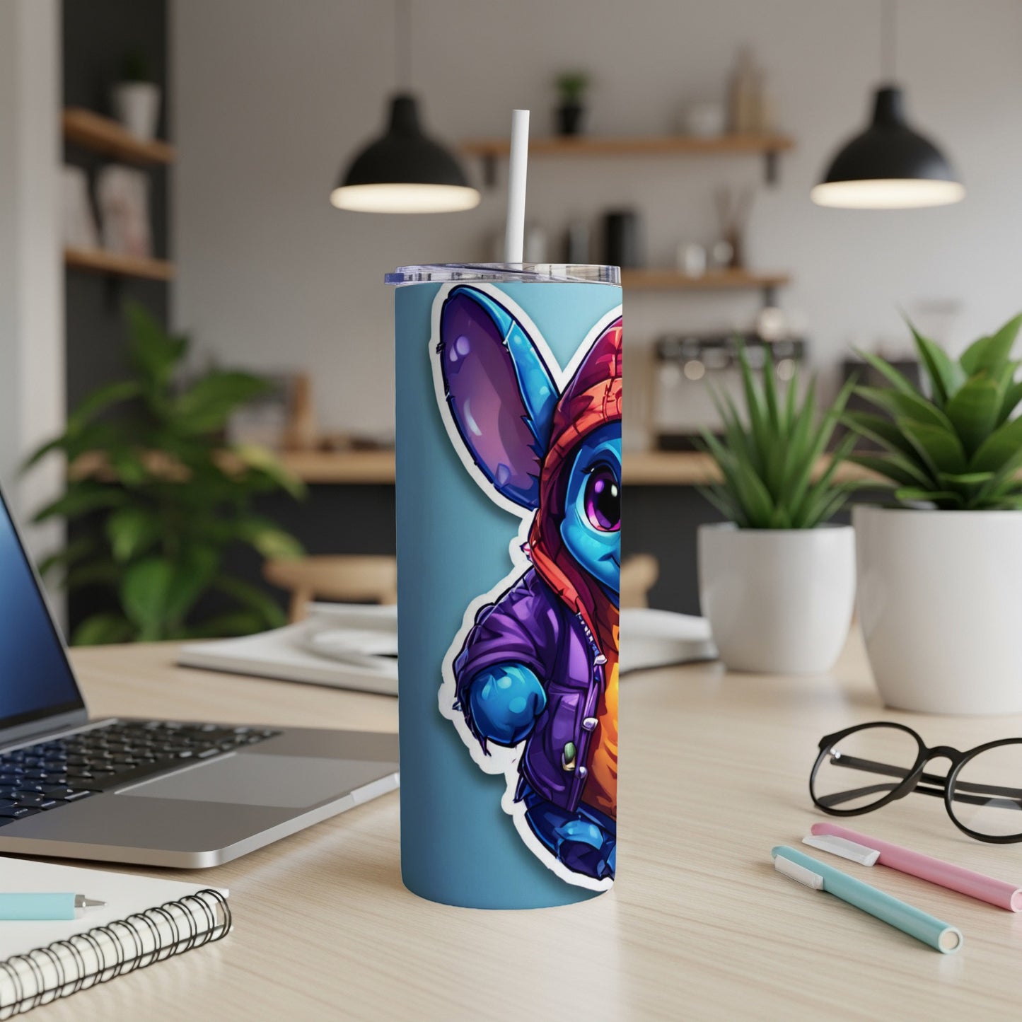 Stitch character in hoodie and jacket on a blue tumbler with straw.