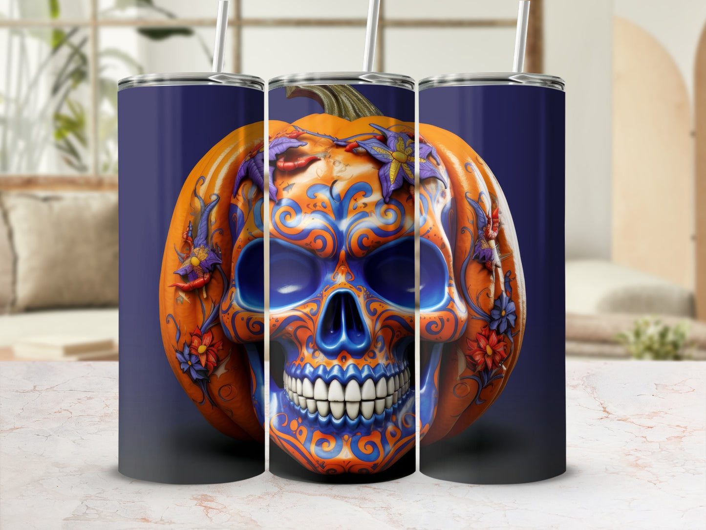 Triptych of tumblers featuring a carved pumpkin skull with blue and orange ornate designs.