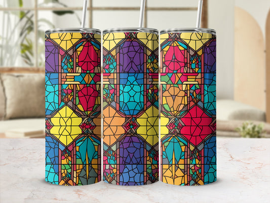 Three stained glass tumblers with geometric patterns and straws.