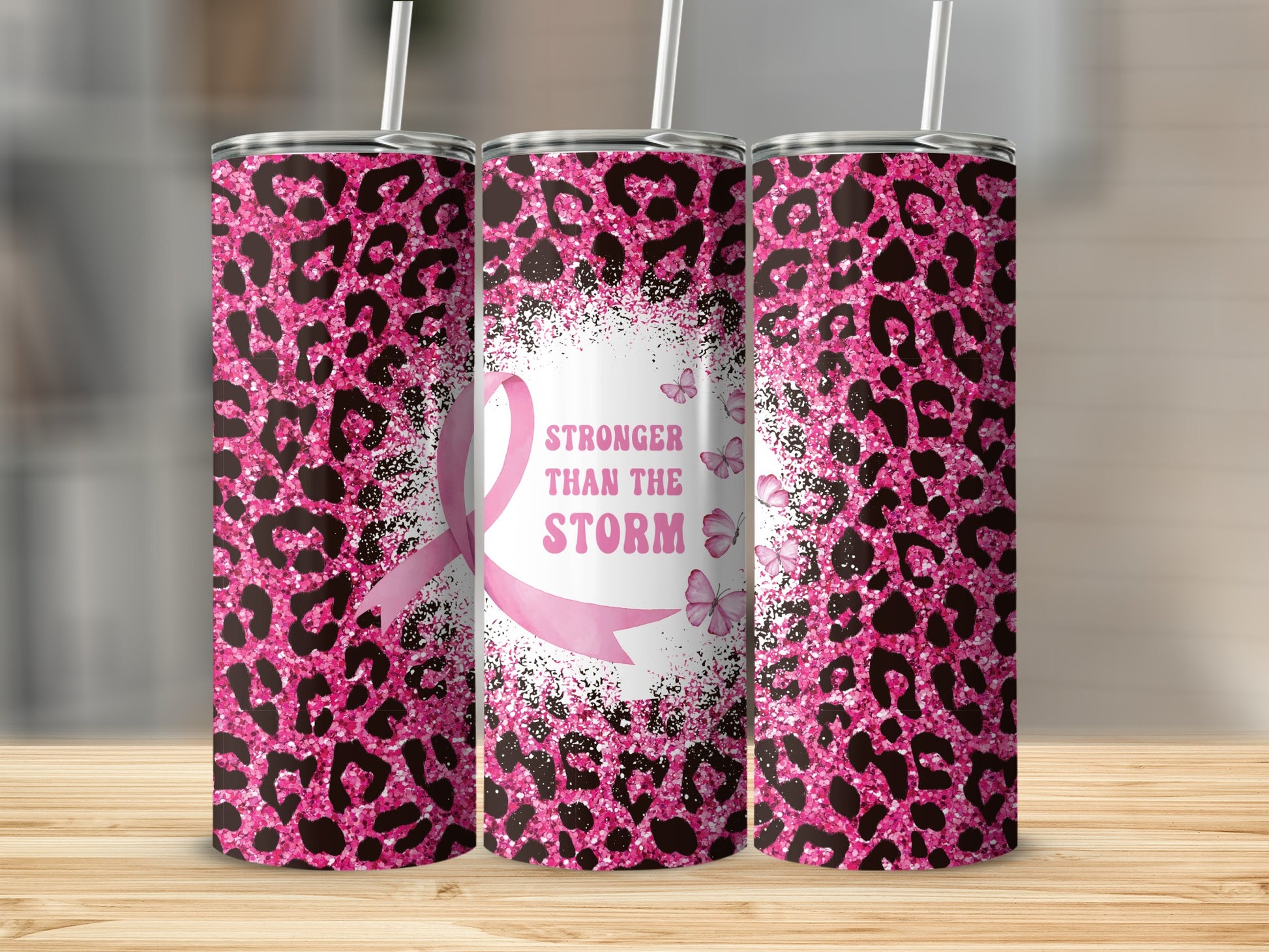 Pink leopard print tumbler with "Stronger Than The Storm" and butterflies.