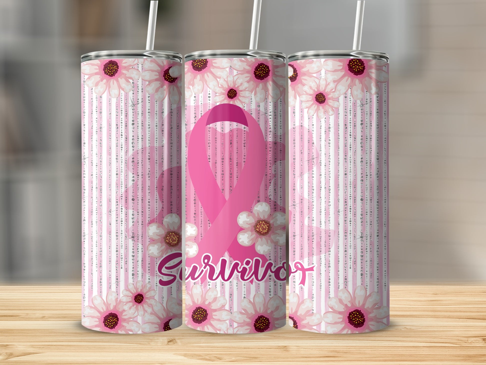 Pink ribbon survivor tumbler with floral accents and striped background.
