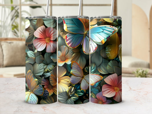 Three tumblers with colorful floral and butterfly designs, displayed on a textured surface.