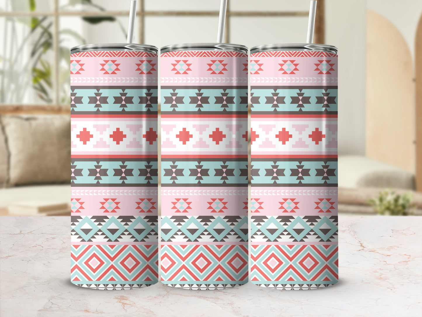 Three tumblers with a pink, teal, and coral geometric Southwestern pattern.